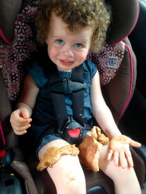 girl eating in car