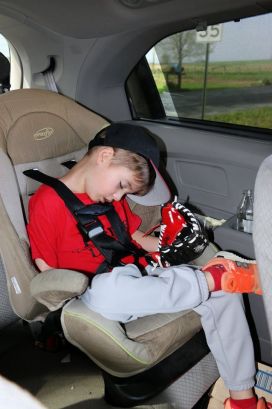 kid sleeping in car